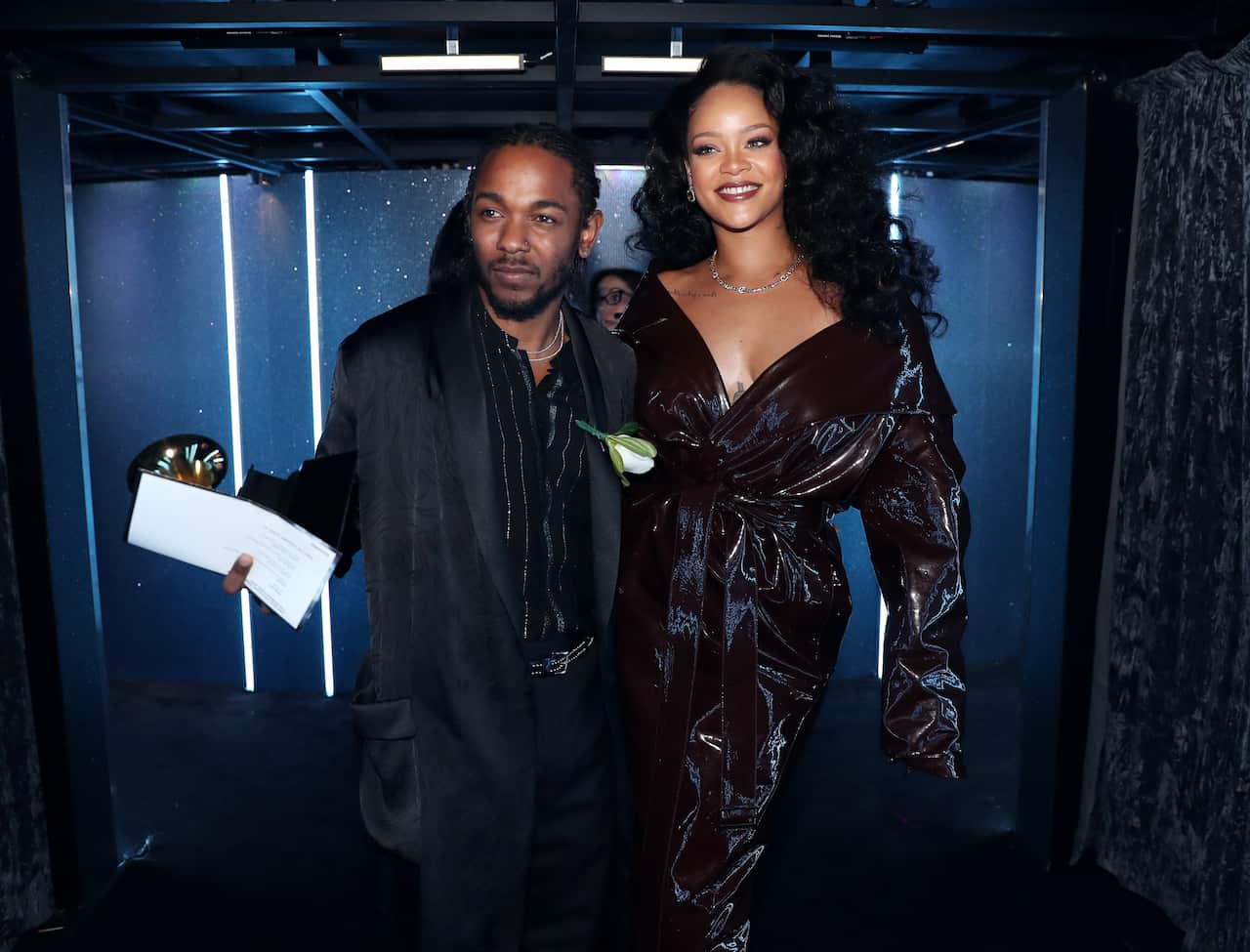 Kendrick Lamar wears a white rose after winning the Grammy for Best Rap Album.