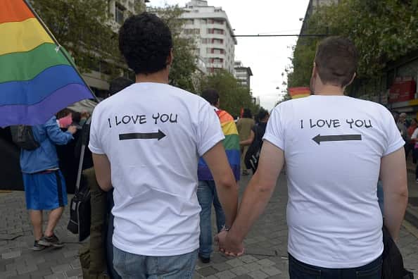 People take part in the Gay Pride Parade in Quito on July 2, 2016. / AFP / RODRIGO BUENDIA        (Photo credit should read RODRIGO BUENDIA/AFP/Getty Images)