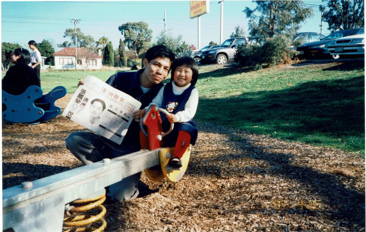 Ting Huang as a child with their father. 