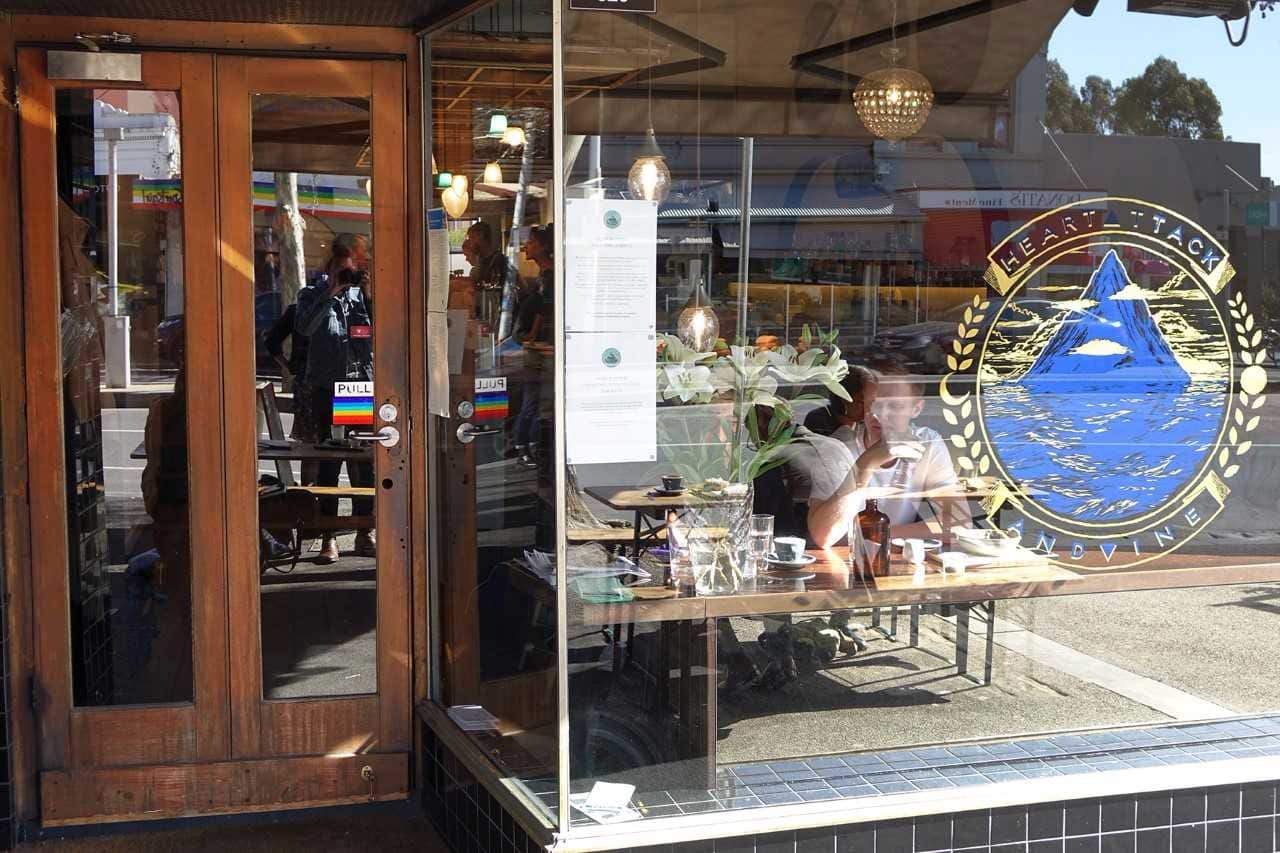 Heart Attack & Vine Bar, displaying the HRC's rainbow flag sticker on their doorway.