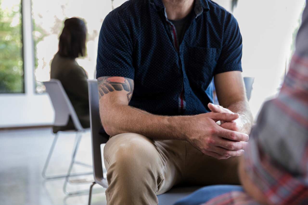 Unrecognizable man during counseling session