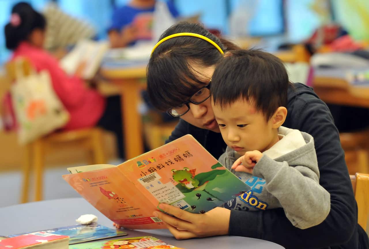 A student reads a book in the Taipei public library in Taipei on November 18, 2012. AFP PHOTO / Mandy CHENG        (Photo credit should read Mandy Cheng/AFP/Getty Images)