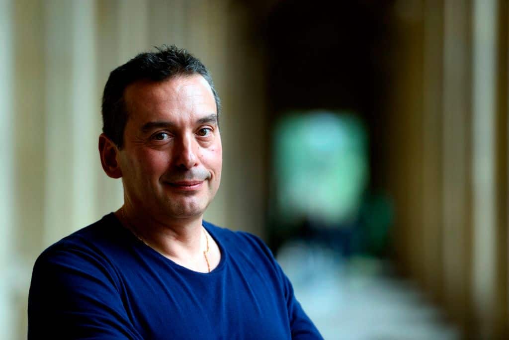 Christos Tsiolkas in a blue shirt