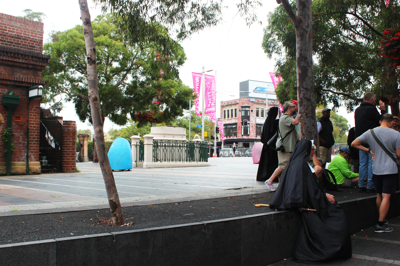 Historian Robert French explains to the crowd that the now-closed underground toilets in Taylor Square were a popular (but dangerous) beat.