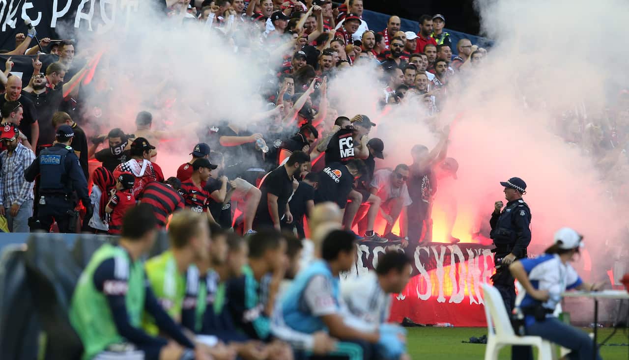 Wanderer fans let off flares