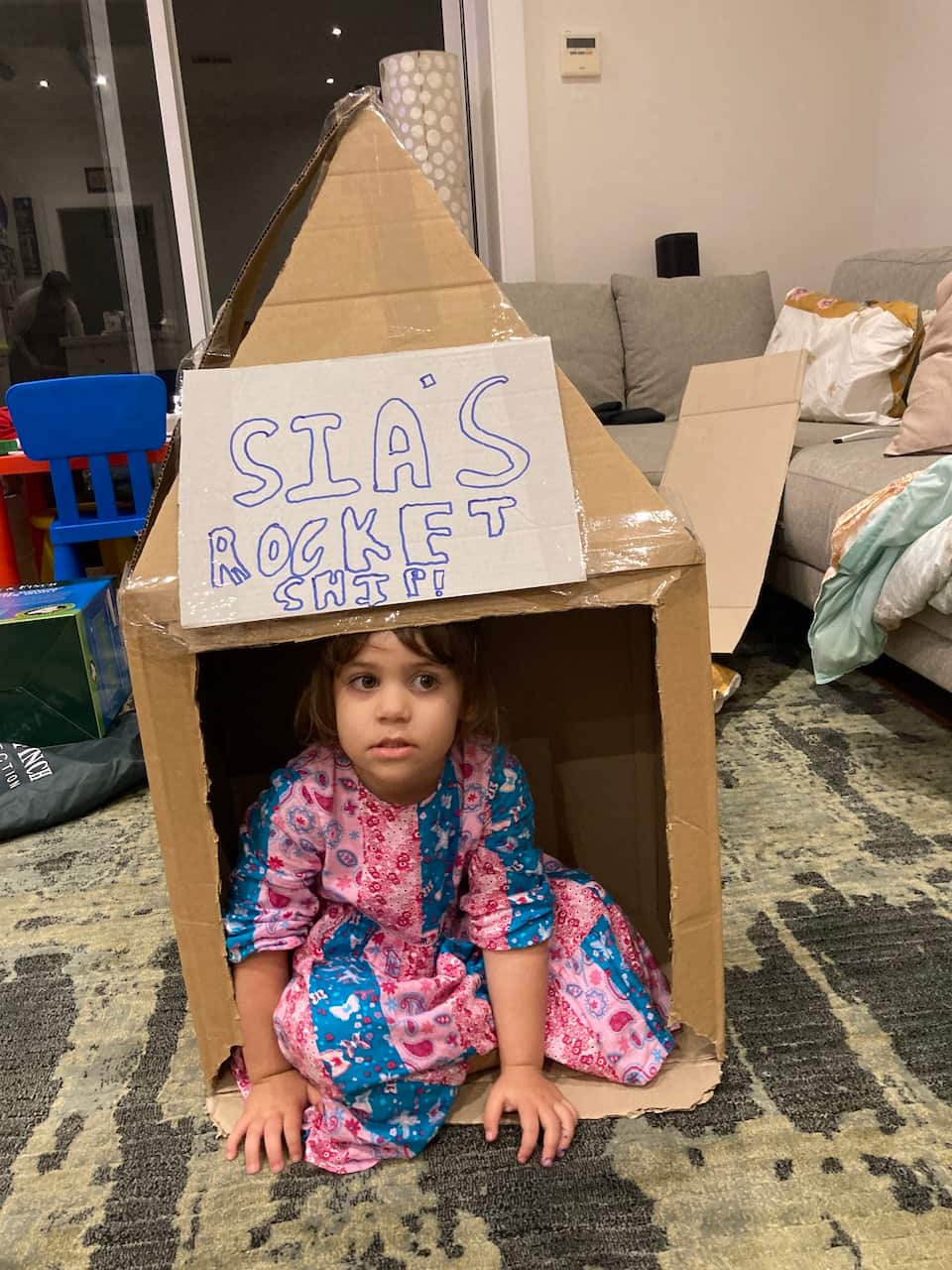 Kids playing with cardboard