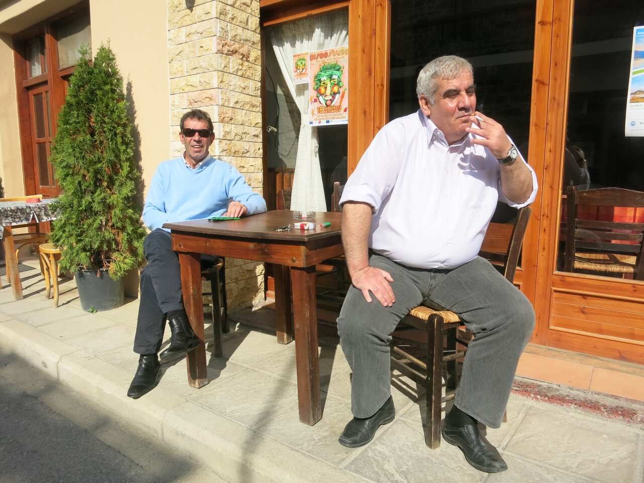 Peter's brothers outside a kafenion in Greece.