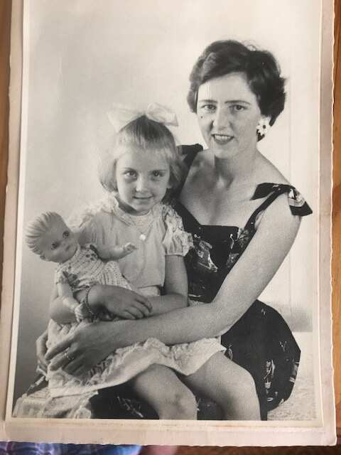 Miranda Jakich as a child, sitting in her mother's lap. Black and white photo from the 60s. 