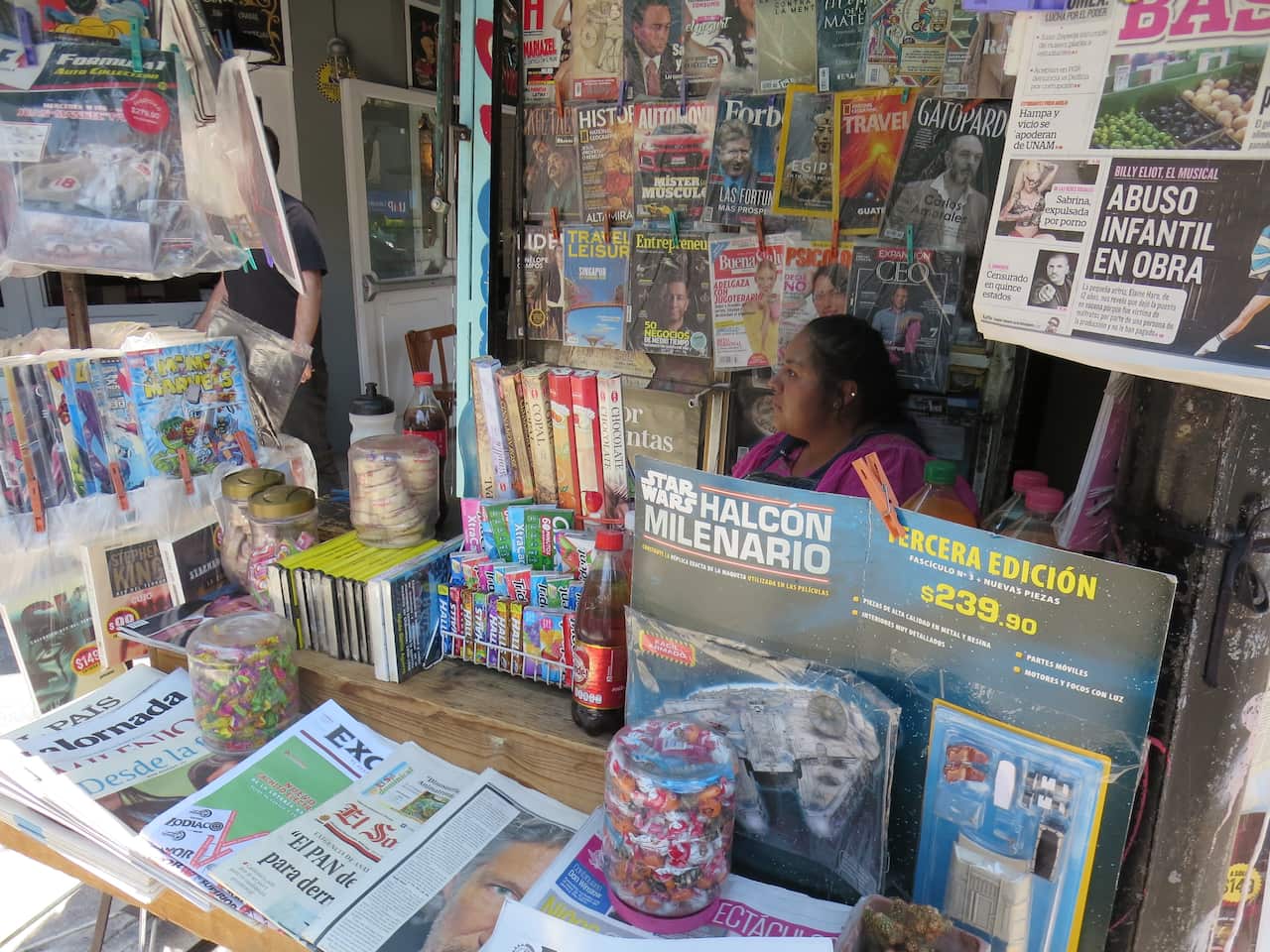 Where I go to buy a paper: Teresa at her newsstand.