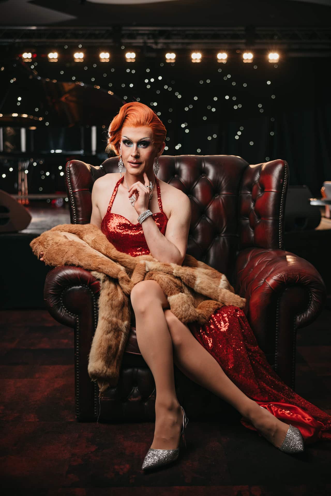 Cougar Morrison sits on a leather arm chair in His Majesty's Theatre