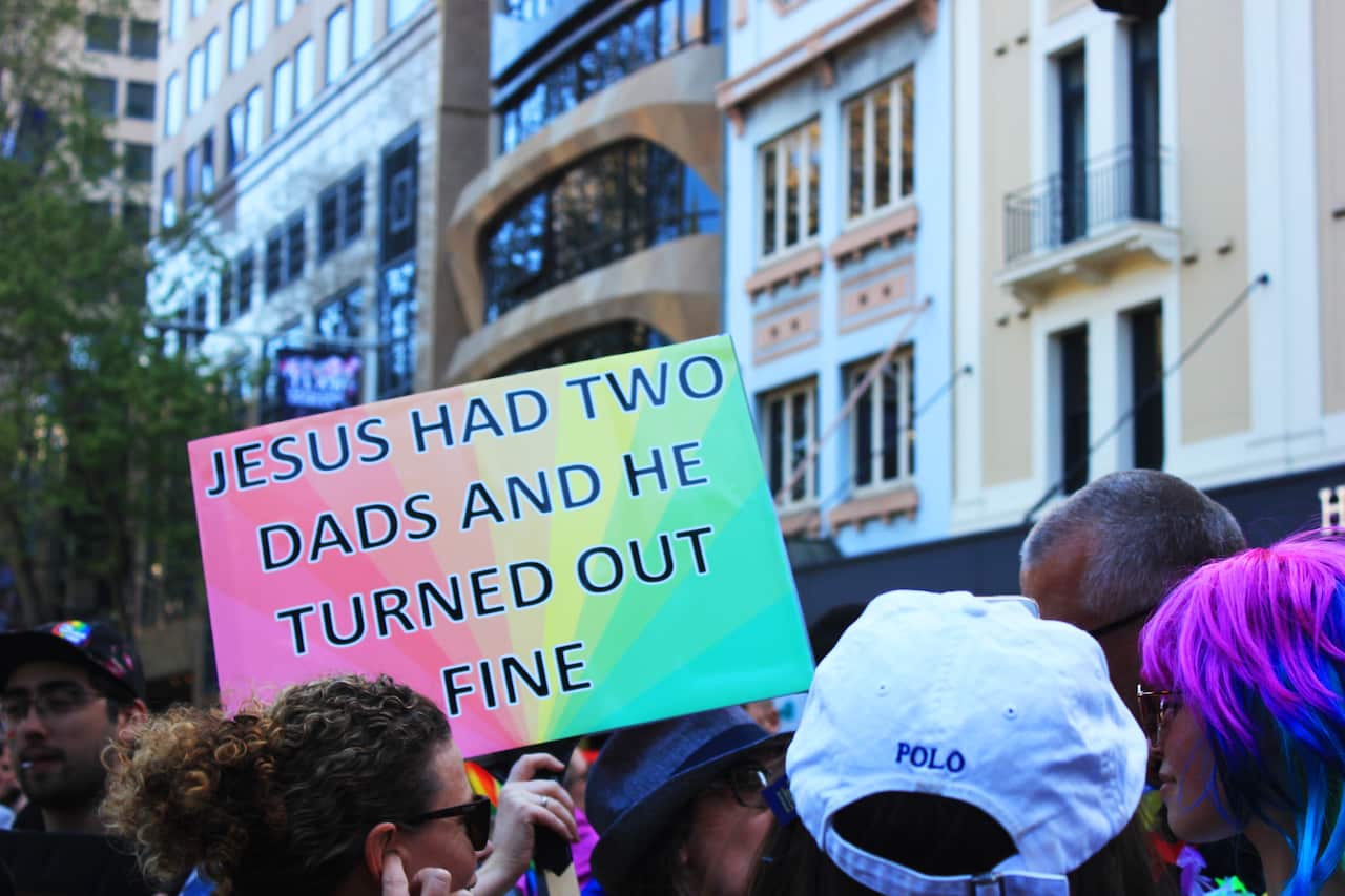 'Jesus had two dads' sign at Sydney Marriage Equality rally on September 10th, 2017. (Photo: Chloe Sargeant / SBS)