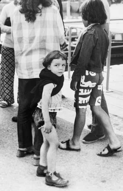 Black and white photo of young girl looking at camera.