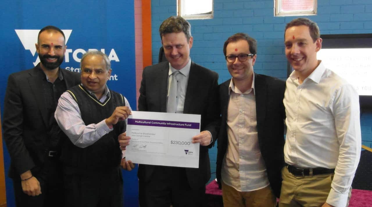 Robin Scott, Minister for Multicultural Affairs presented the cheque to Jain community to develop community center in Melbourne