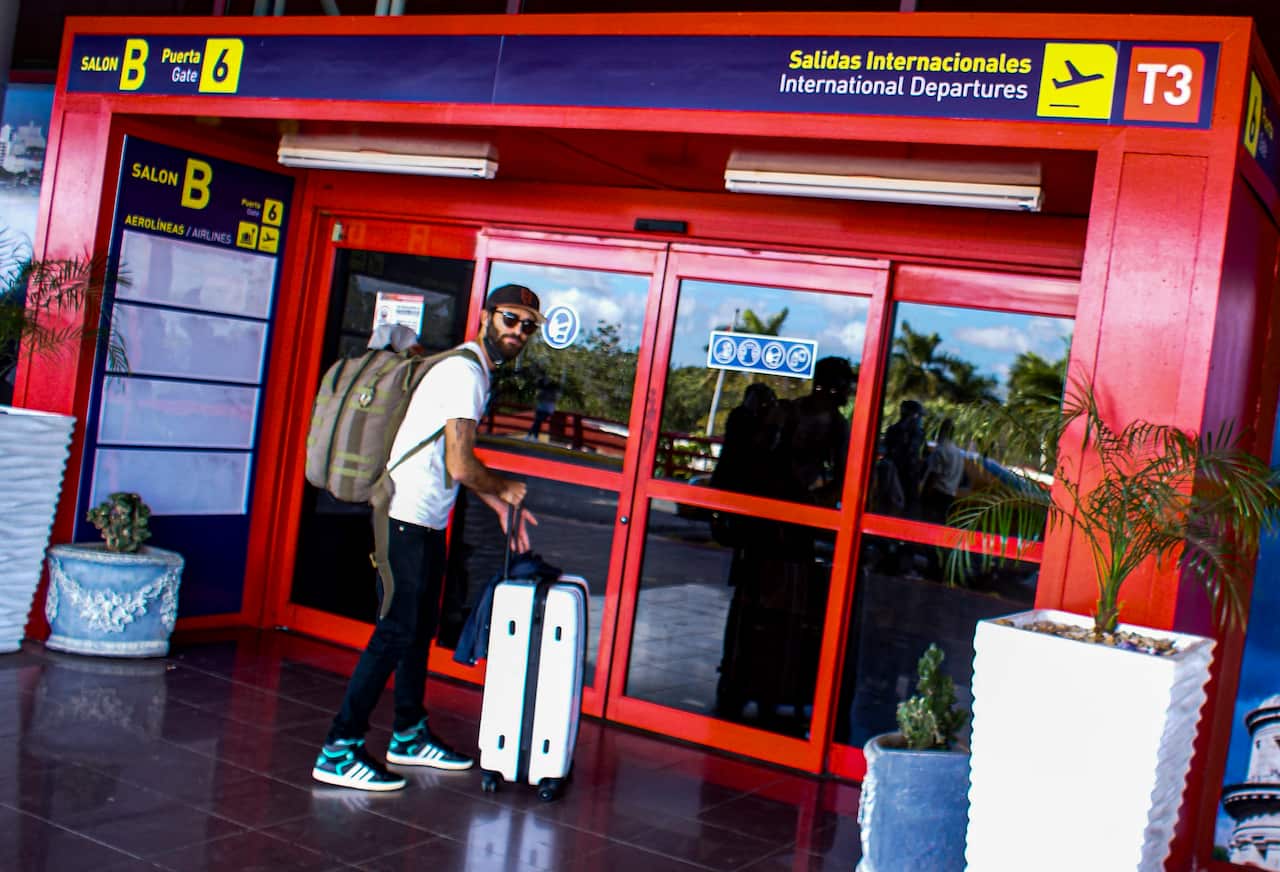 Raul Prado and Aidana Hernandez Febles never imagined they would emigrate from Cuba to Miami following three years of economic crisis, they gave up hope and joined thousands of others in fleeing the island nation. (Photo by CARLOS BATISTA / AFP)