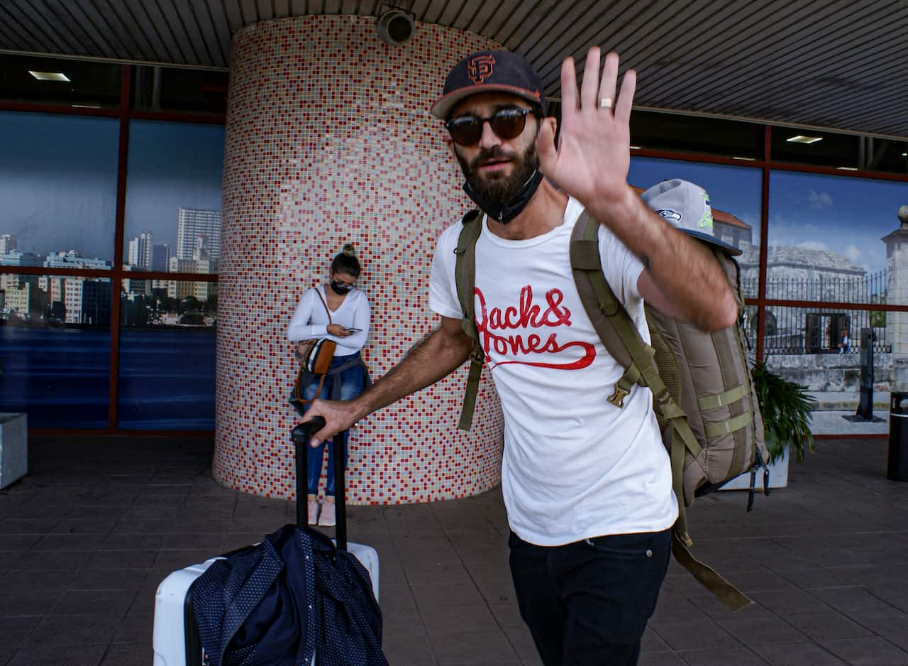 Cuban director of photography Raul Prado arrives at the airport in Havana to travel to the United States, on March 12, 2022.