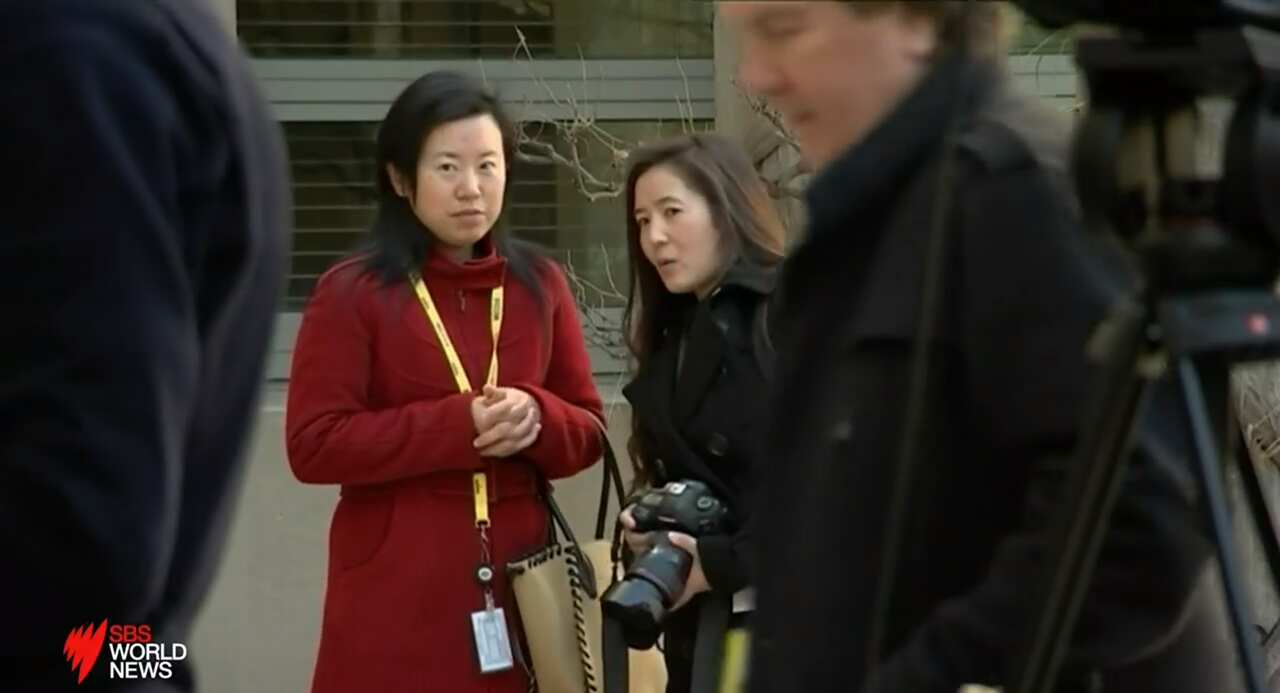 The female photographer who had been seen taking photos of other Australian journalists believed to be in attendance at the media event with the Xinhua News reporter.