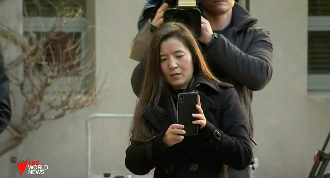 A female photographer had been seen taking photos of other Australian journalists.