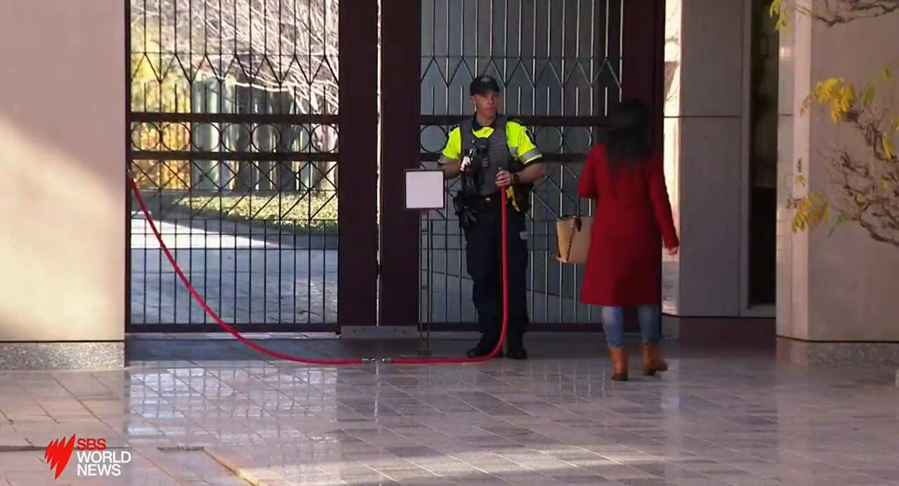 The Xinhua News reporter suddenly left the press conference after the scuffle drew the attention of several journalists and Australian Federal Police officers.