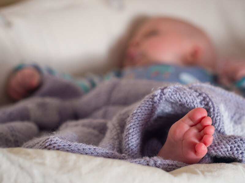 A baby sleeping in a basket