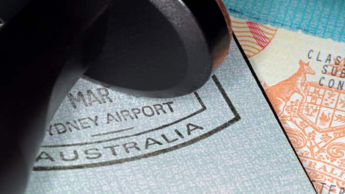 A passport with Australian immigration stampand visa