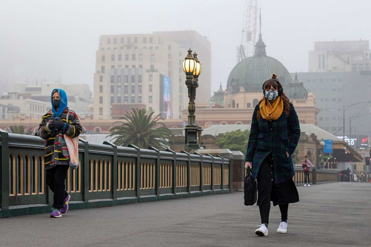 People walking along the Princes Bridge in Melbourne,