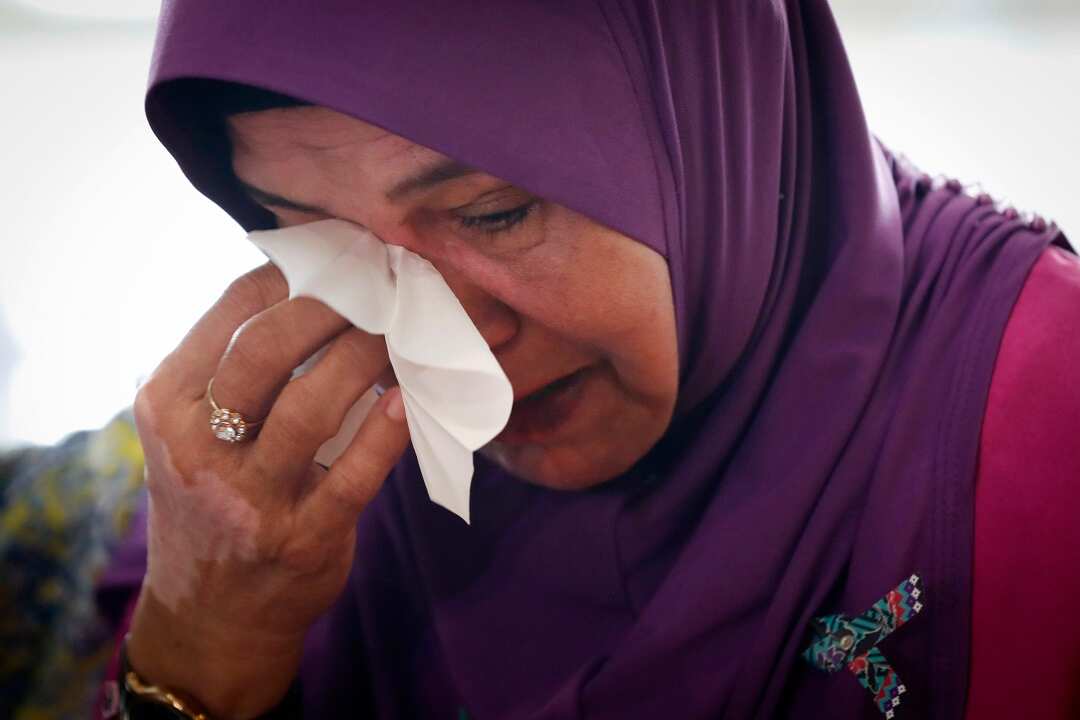 The mother of a passenger MH370 in Malaysia on Monday.