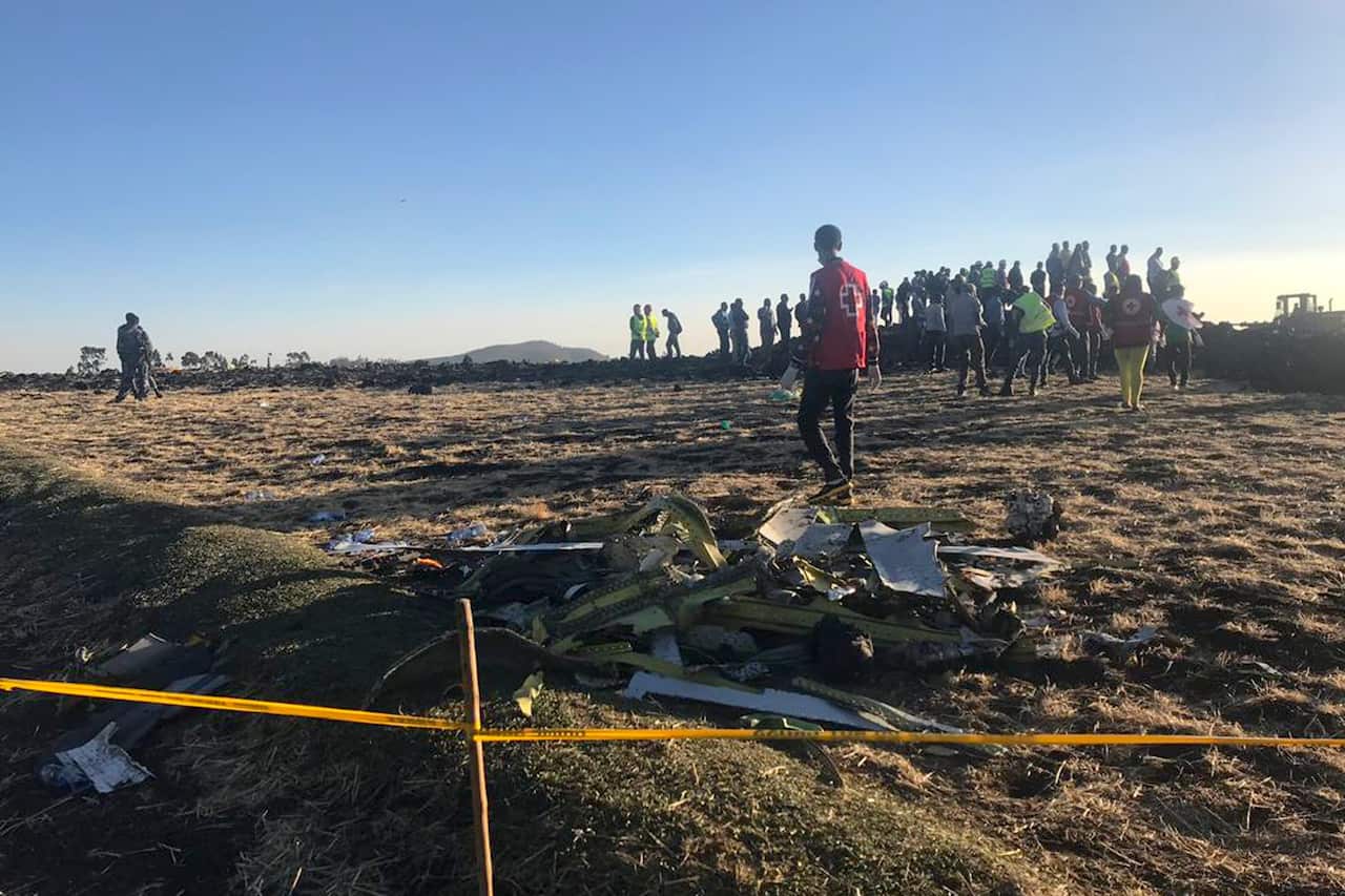 Rescuers search at the scene of an Ethiopian Airlines flight that crashed shortly after takeoff at the scene at Hejere near Bishoftu.