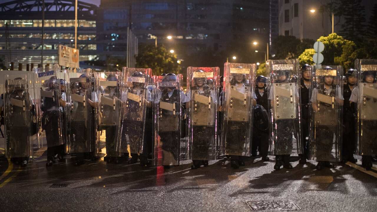 Police in riot gear block a road leading to the Legislative Council in Hong Kong.