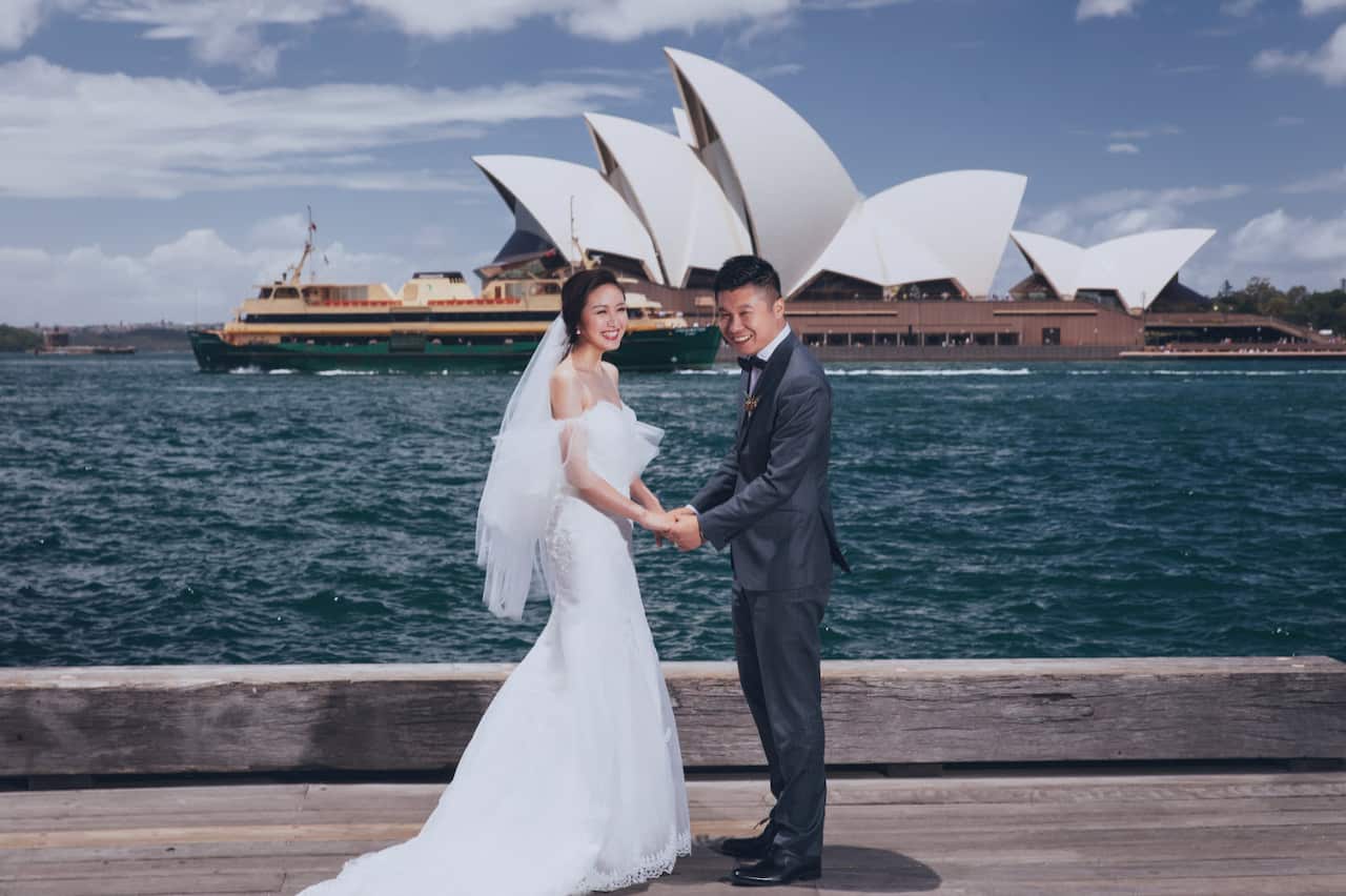 Pre-wedding photos in front of the iconic Sydney Opera House is a popular choice.