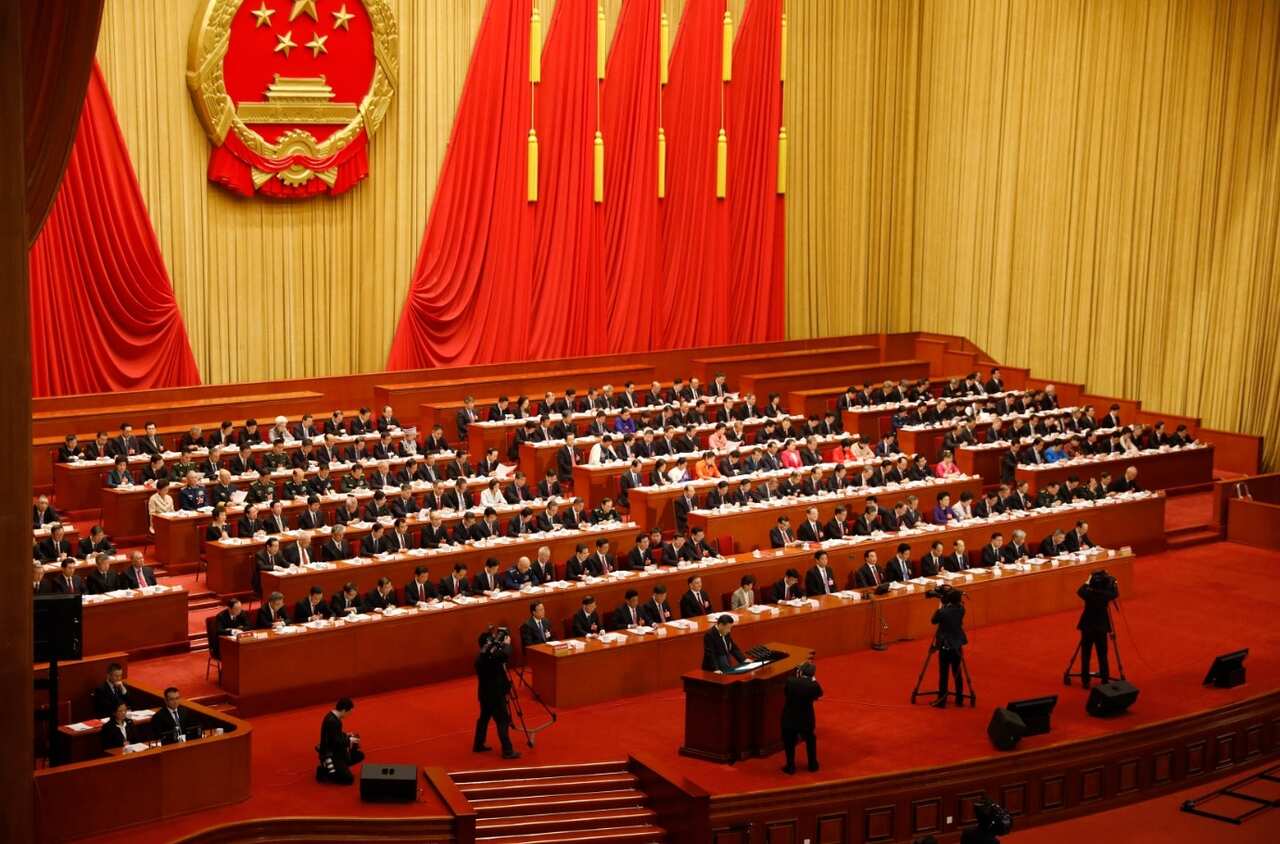 Chinese President Xi Jinping (C, front) delivers his speech during the closing of the first session of the 13th National People's Congress (NPC)
