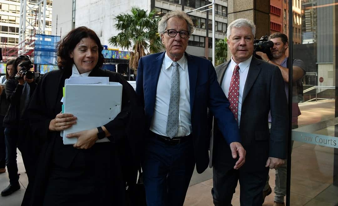 Australian actor Geoffrey Rush (centre) arrives at the Federal Court in Sydney, Tuesday, October 23, 2018. Rush is suing Nationwide News for defamation. (AAP Image/Brendan Esposito) NO ARCHIVING