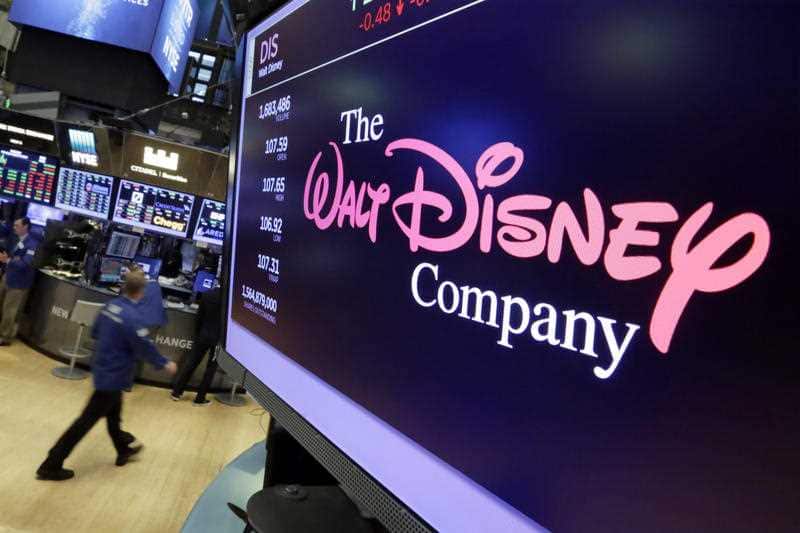  In this Monday, Aug. 7, 2017, file photo, The Walt Disney Co. logo appears on a screen above the floor of the New York Stock Exchange.