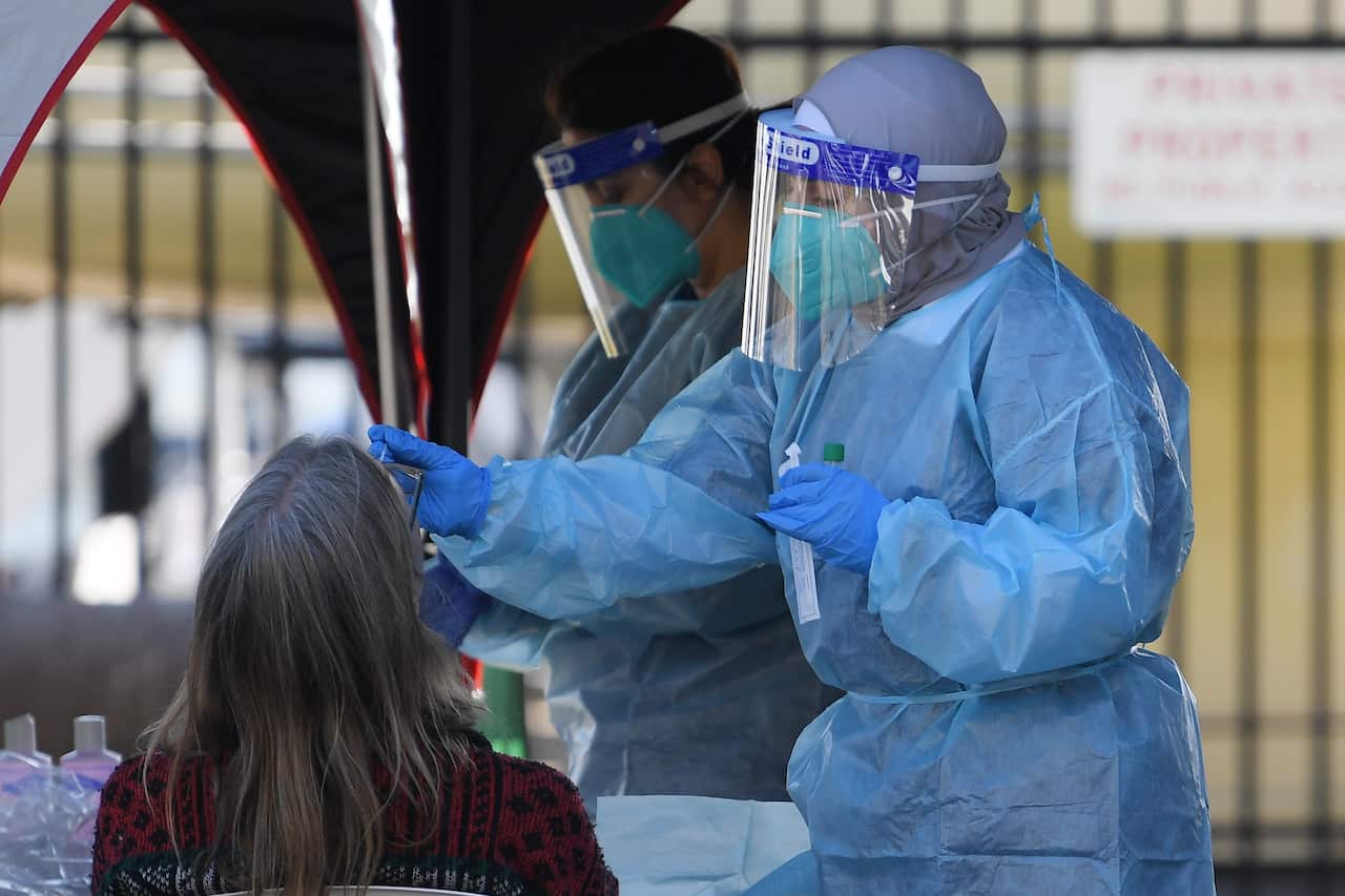 People line up for COVID-19 testing at a pop-up clinic at Rushcutters Bay in Sydney on 29 July.