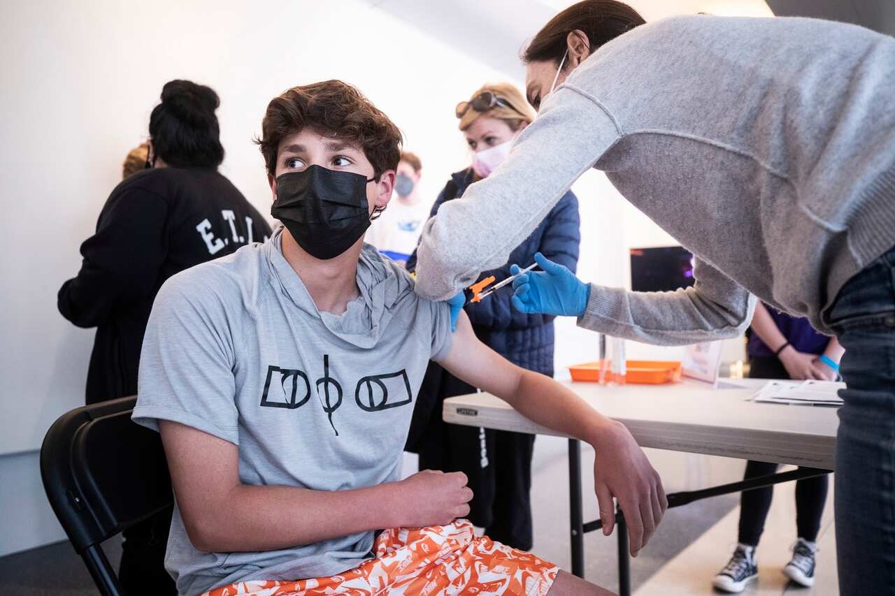  A 14-year-old boy receives a dose of COVID-19 vaccine during a vaccination drive for teenagers aged between 12 and 15 in Los Angeles, California.