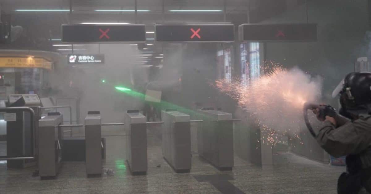 Hong Kong Police shoot tear gas inside MTR station. 