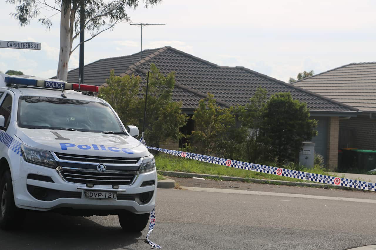 Police in front of the deceased house