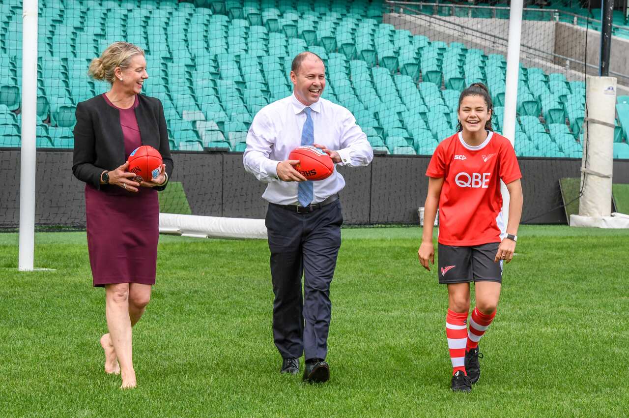 Senator Bridget McKenzie, Treasurer Josh Frydenberg and Zali Deep from the Swans Academy, are seen during a media event at the Sydney Cricket Ground, Sydney.