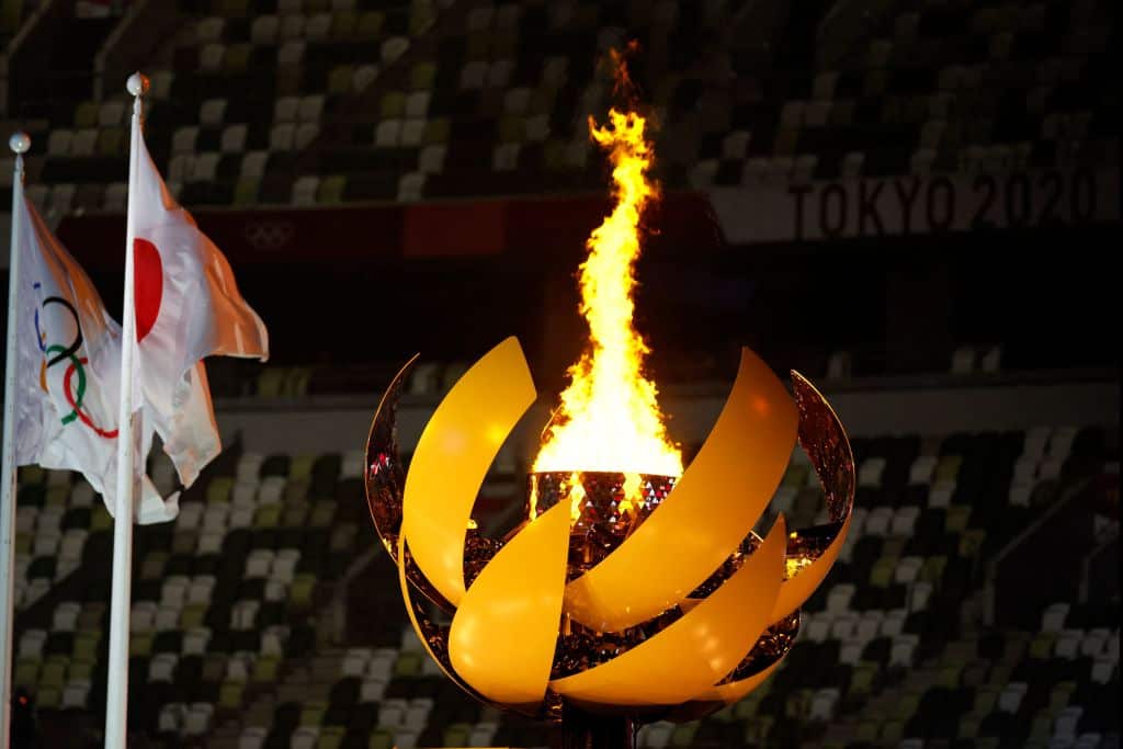 Olympic Flame and Cauldron next to the Japanese and Olympic flags during the opening ceremony of the Tokyo 2020 Olympic Games in Tokyo, on 23 July, 2021.