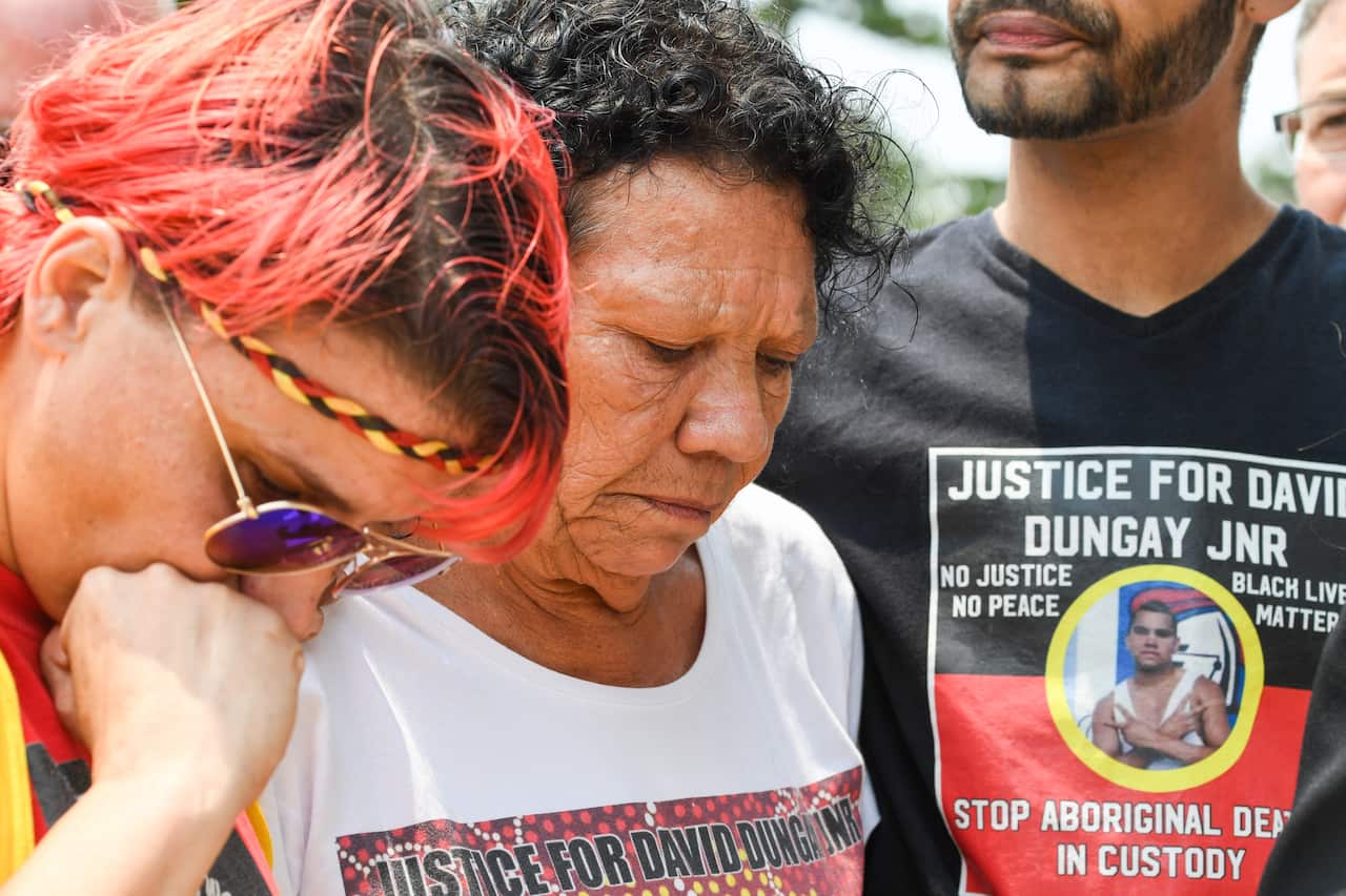 David Dungay's cousin Lizzie Jarrett and his mother Leetona Dungay and nephew Paul Silva outside the Lidcombe Coroner's Court in Sydney.