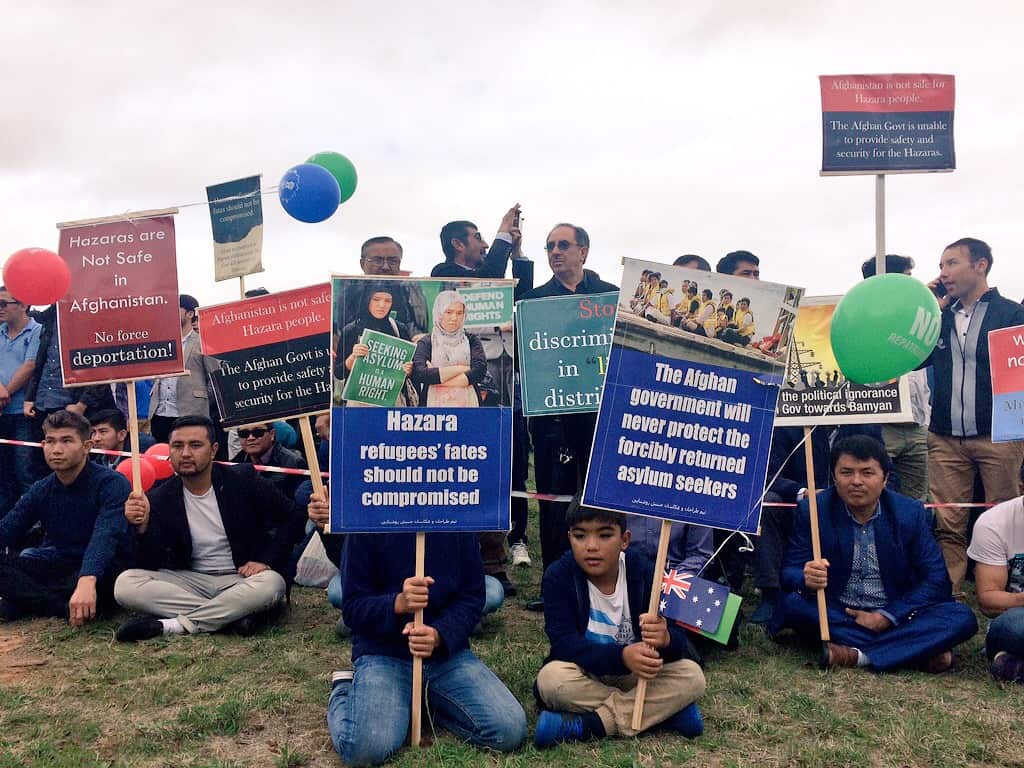 Hazaras protest the arrival of Afghanistan's president at Government House in Canberra on April 4, 2017.