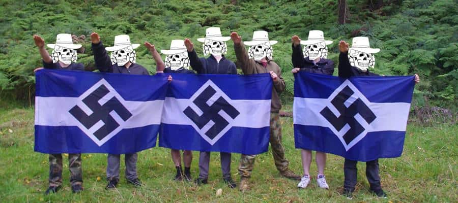 Members of the Antipodean Resistance stand with a Nazi solute.  