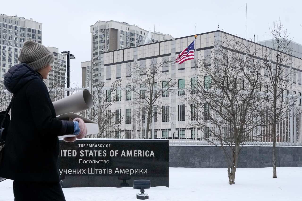 A woman walks past the US Embassy in Kyiv, Ukraine, 24 January 2022. 