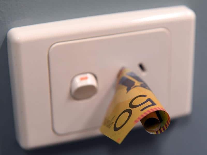 A $50 note is seen inserted into a power point in Melbourne
