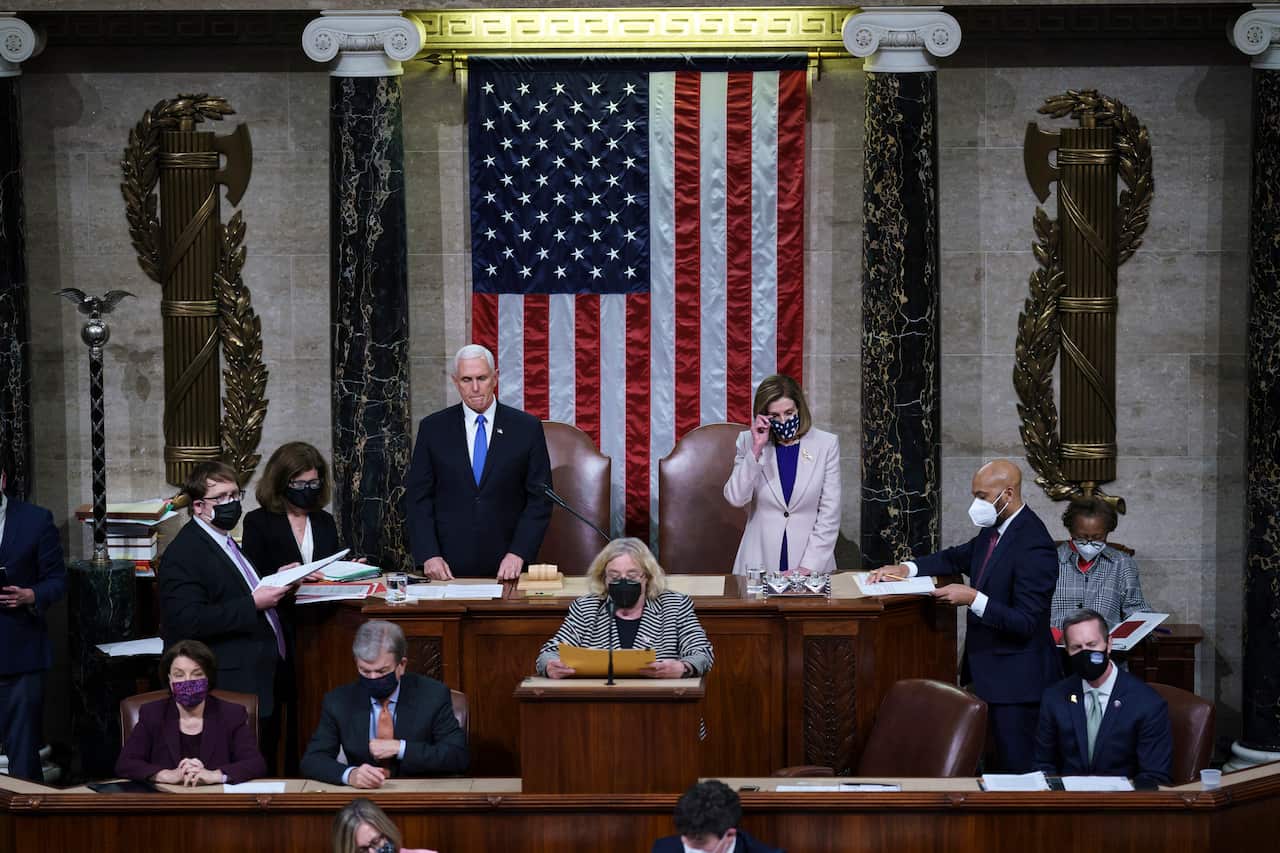 Vice President Mike Pence and Speaker of the House Nancy Pelosi read the final certification of Electoral College votes cast in November's presidential election