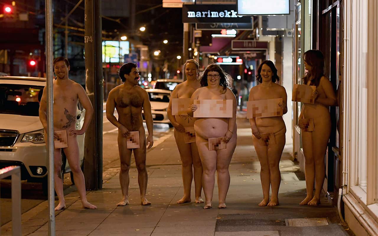 Nude models pose for a photograph on Chapel Street, Melbourne, Thursday, July 5, 2018.