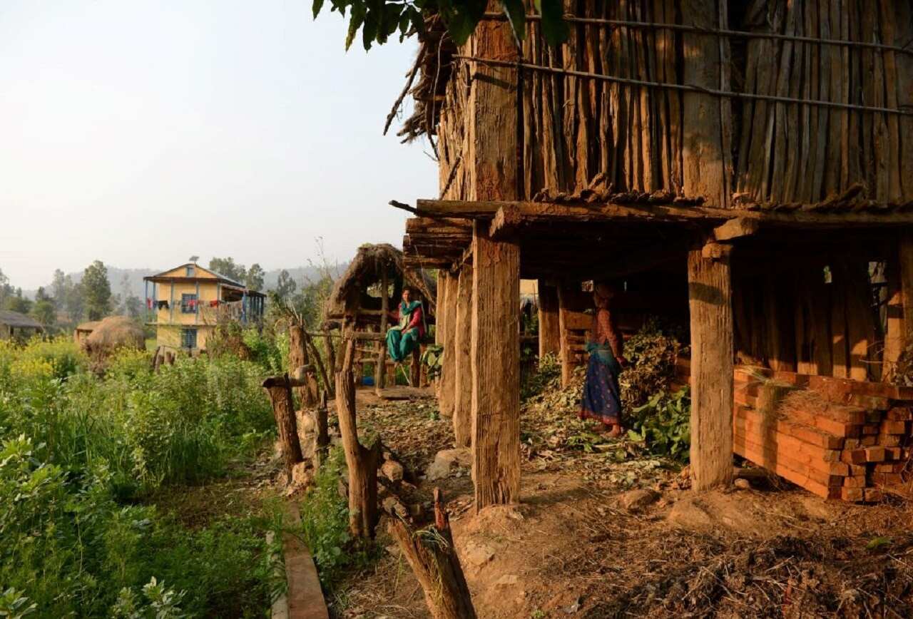 A Nepalese woman looks at a Chhaupadi hut during her menstruation period in Surkhet District, west of Kathmandu.