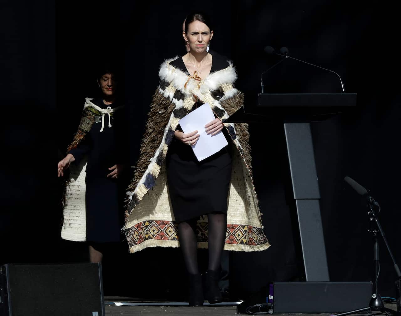 New Zealand Prime Minister Jacinda Ardern walks onto the stage to address a national remembrance service in Hagley Park for the victims of the March 15 mosque terrorist attack in Christchurch, New Zealand, Friday, March 29, 2019. (AP Photo/Mark Baker)