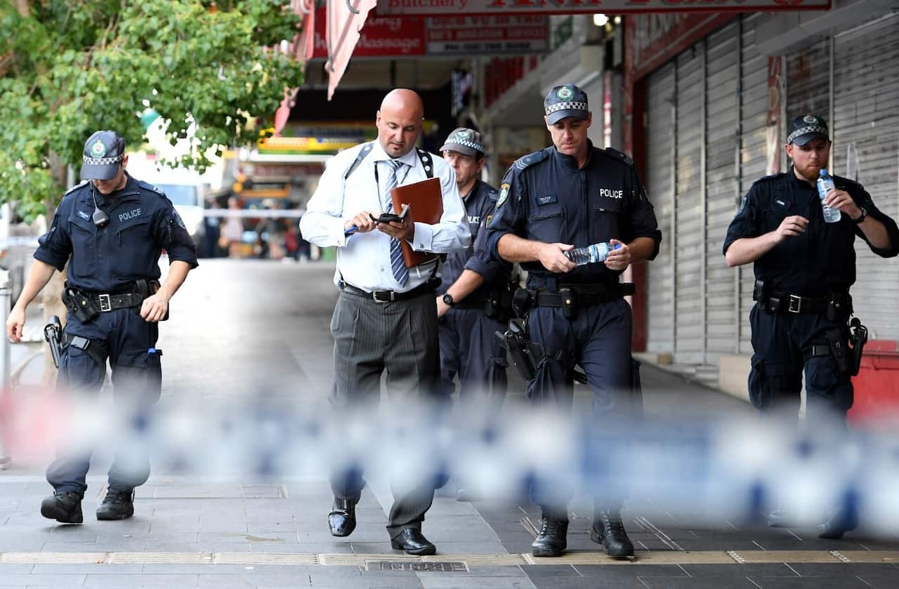NSW Police attend the scene of a shooting at a cafe at Bankstown City Plaza, in Bankstown, Tuesday, January 23, 2018. 