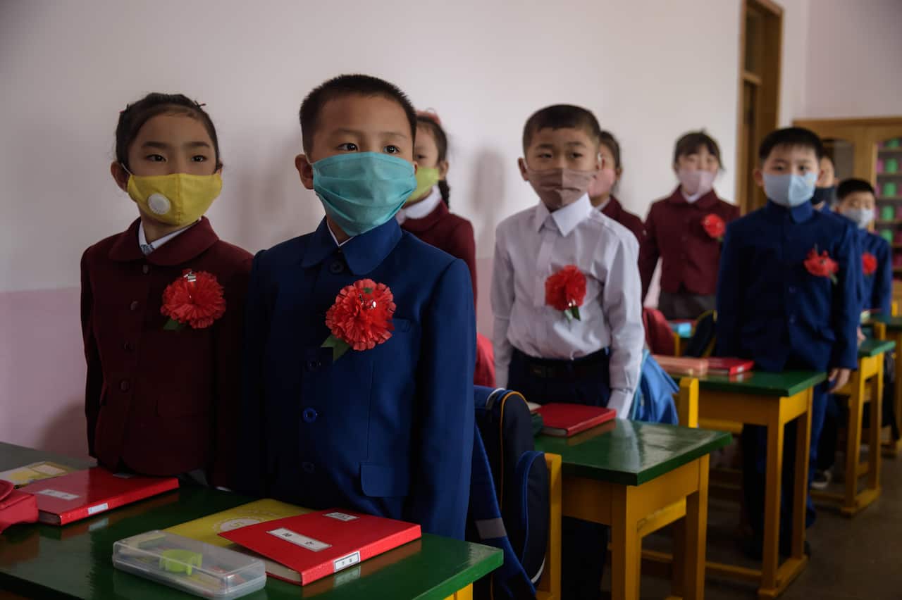 Primary school children in Pyongyang wear face masks as a protective measure against COVID-19 since classes returned in June 2020.