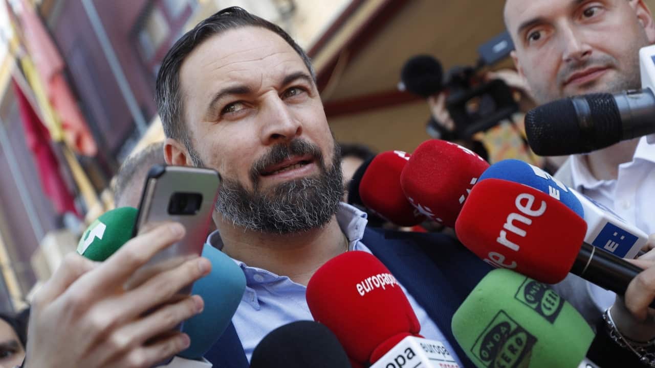 President of right-wing party Vox, Santiago Abascal, addresses the media after casting his vote.